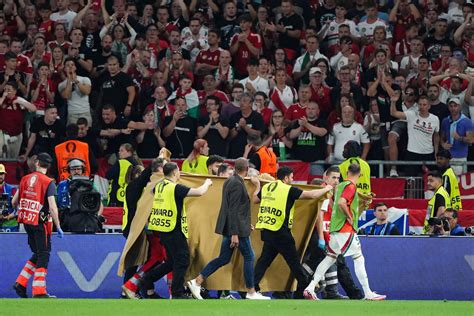 Hungary's Varga stable after going off on stretcher .